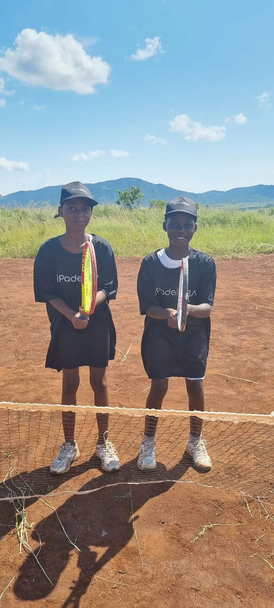 Two young players with their rackets