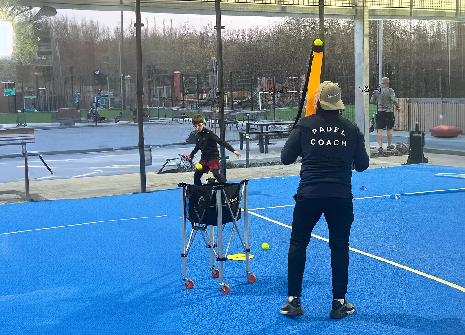 NJ coaching a junior padel player
