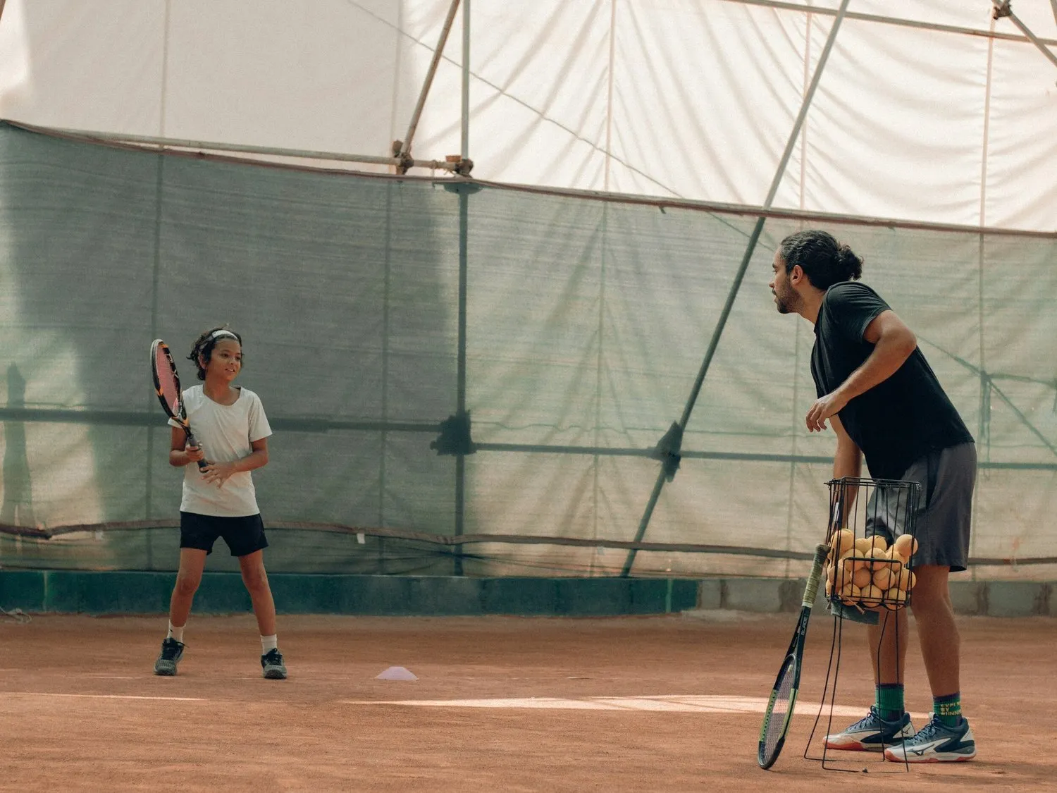 Junior tennis player in a mentor session