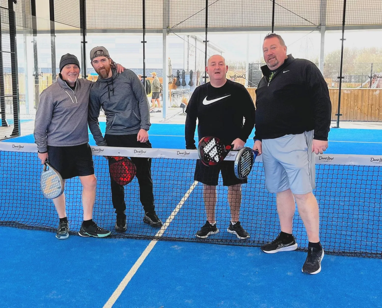 Padel players at the net after a game